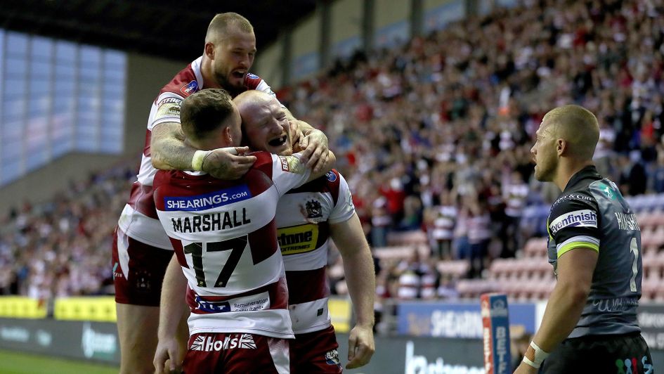 Wigan celebrate Liam Farrell's hat-trick