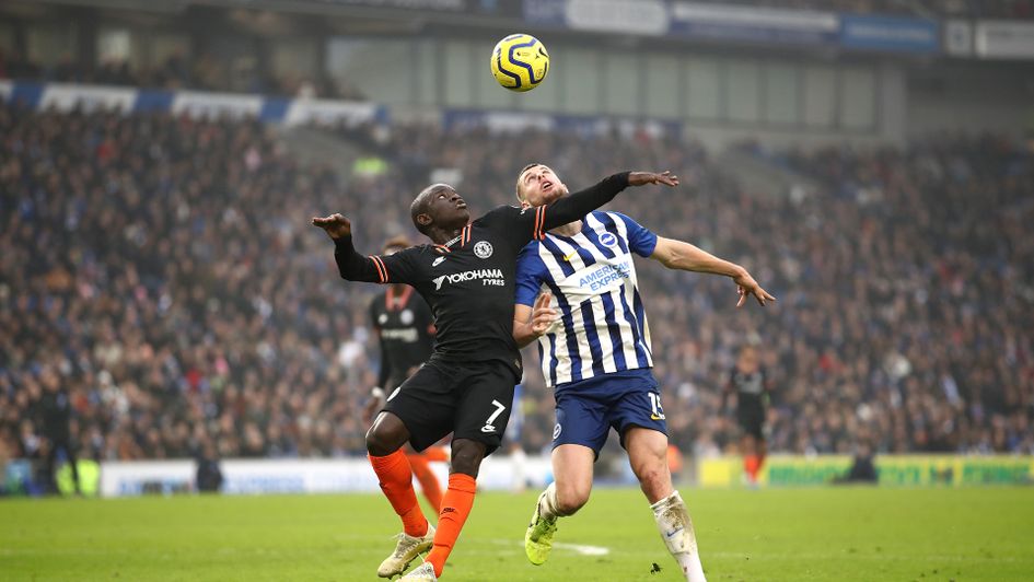 N'Golo Kante and Adam Webster battle for the ball