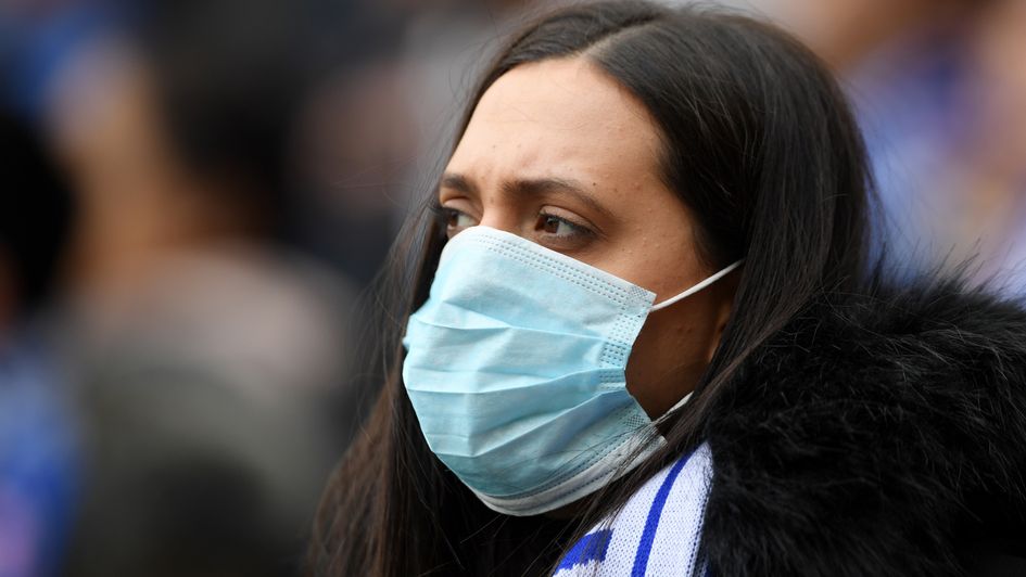 A fan wears a mask during Chelsea v Everton
