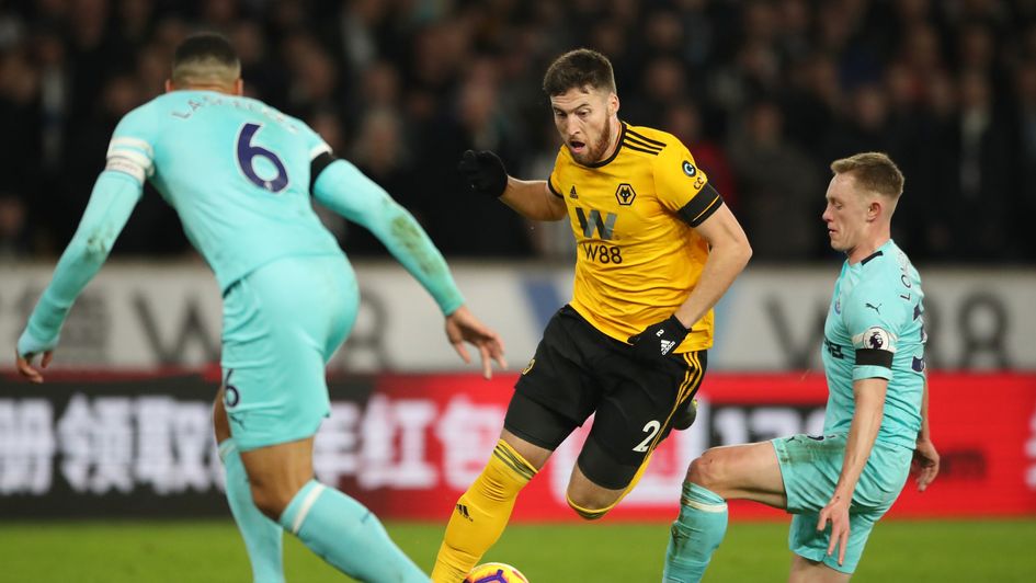 Newcastle's Sean Longstaff challenges Wolves' Matt Doherty