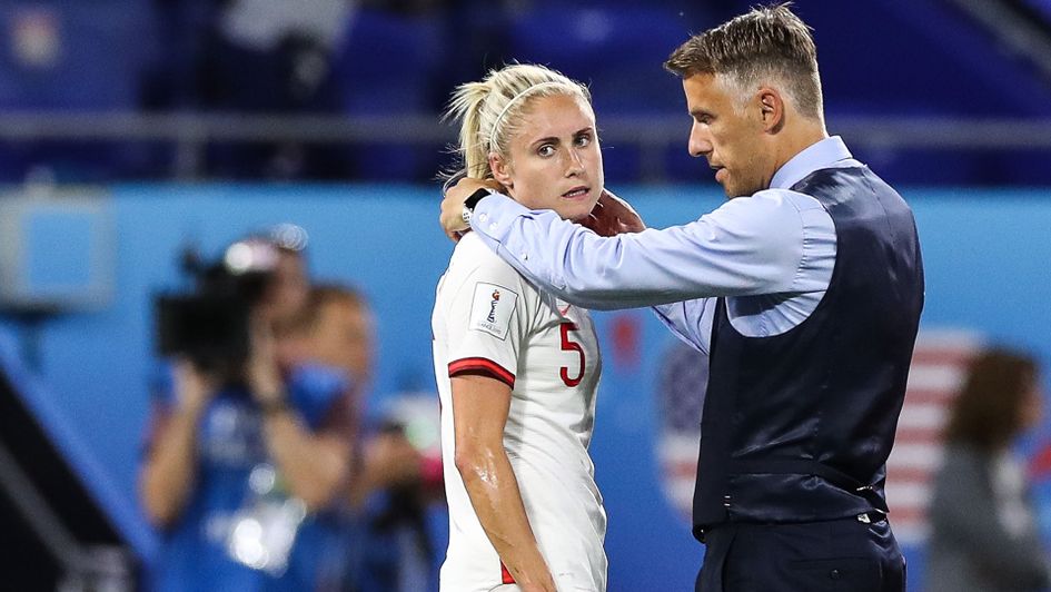 England boss Phil Neville comforts captain Steph Houghton