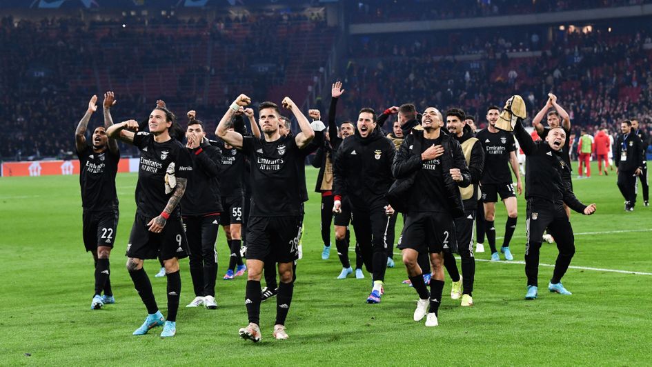 Benfica players celebrate beating Ajax in the Champions League last 16