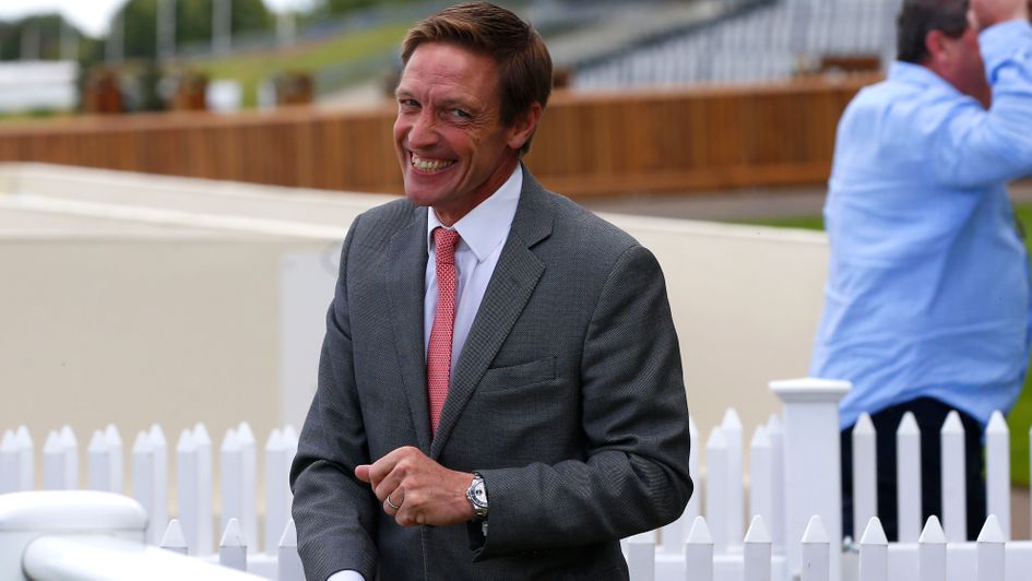 Winning trainer Richard Hughes is all smiles