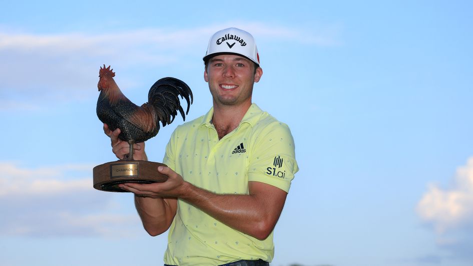Sam Burns poses with the trophy after winning the Sanderson Farms Championship