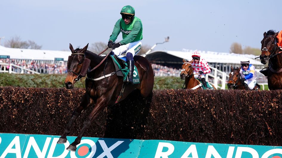Impaire Et Passe flies over the last at Aintree in the hands of Paul Townend