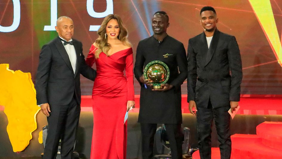 Sadio Mane (centre, right) with Ahmad Ahmad (left), President of the Confederation of African Football, and Samuel Eto'o (right)