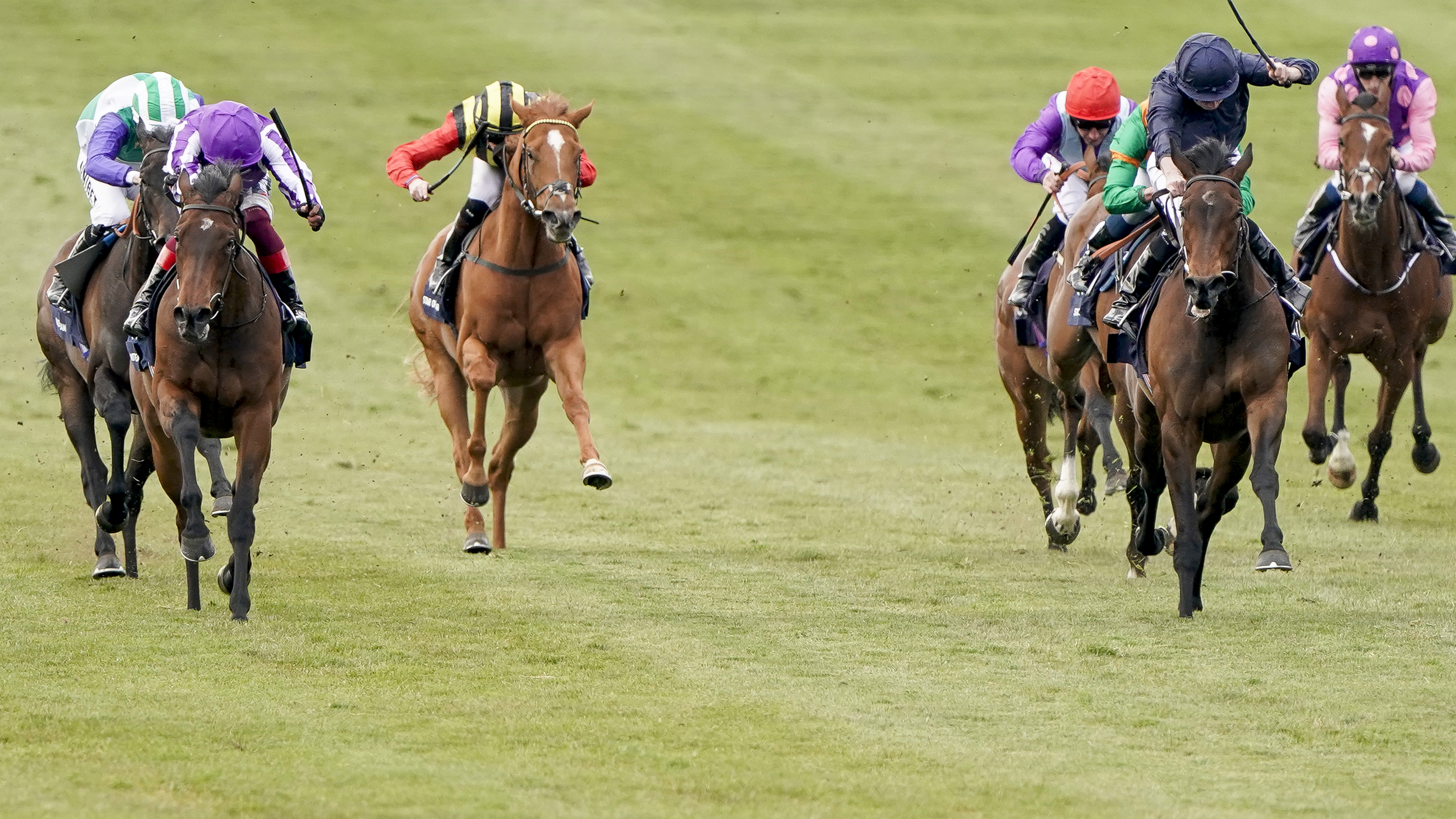 Mother Earth (left) wins the 1000 Guineas