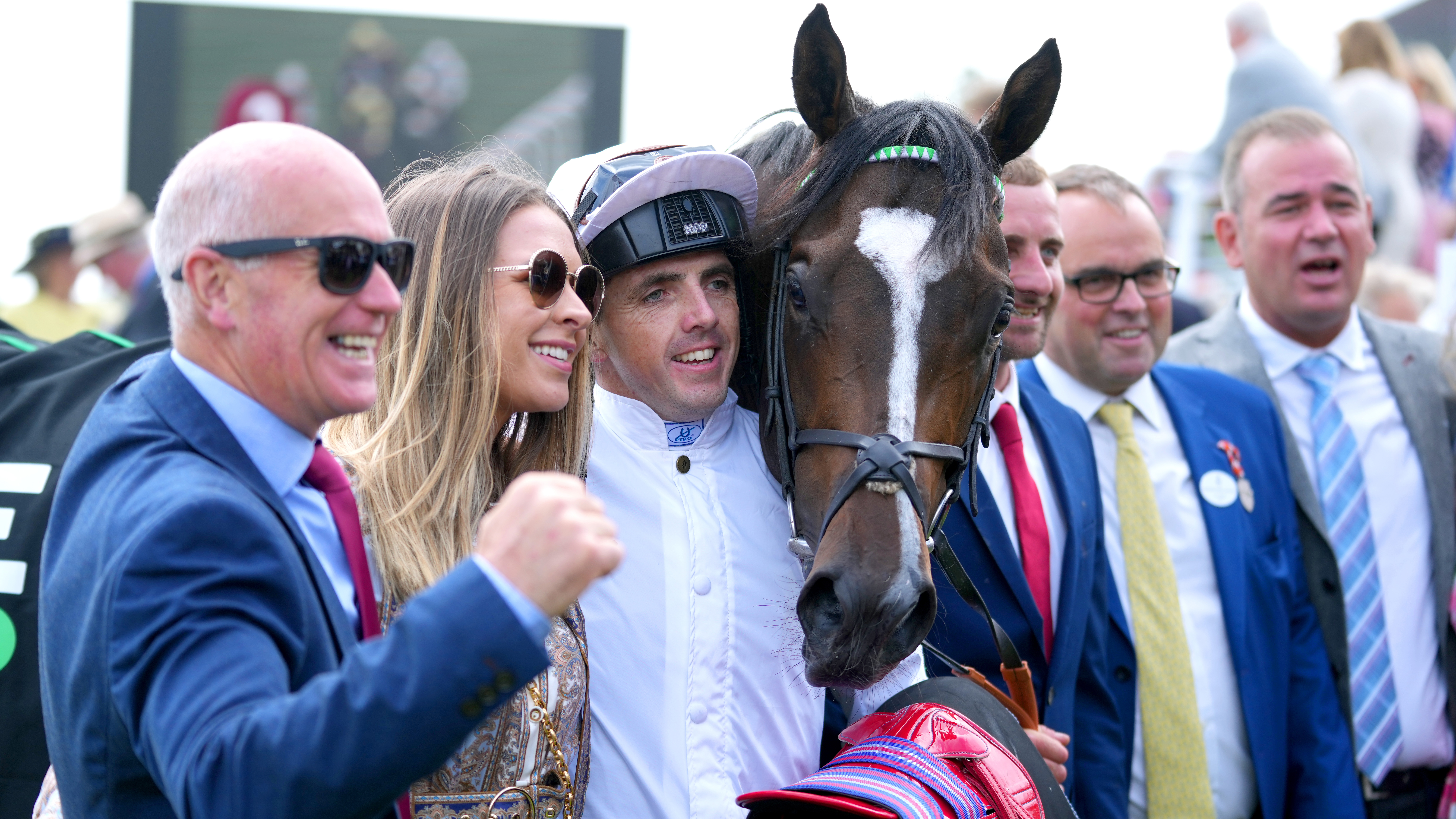 Martin Harley (third left) celebrates in the winners enclosure after winning the Unibet Richmond Stakes on Asymmetric